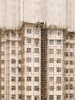 Illustration for article titled The Surreal Sight of Skyscrapers Encased in Colored Fabric